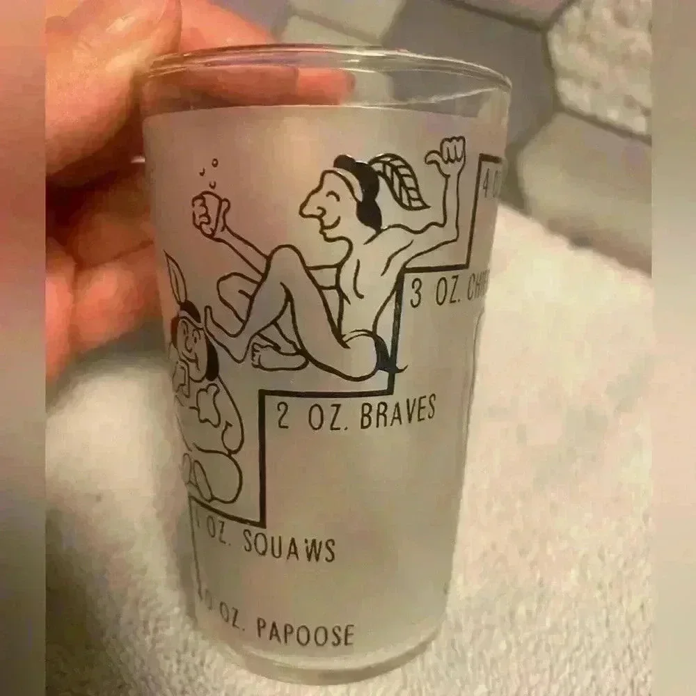 4 oz Indian novelty shot glass from Canada. Frosted glass with gold rim EUC